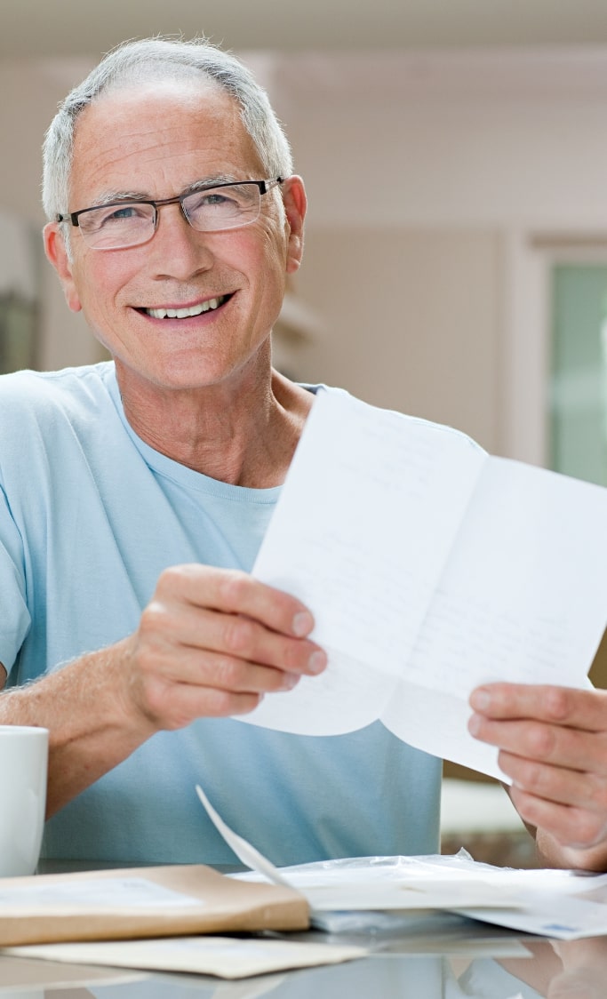 smiling veteran with letter