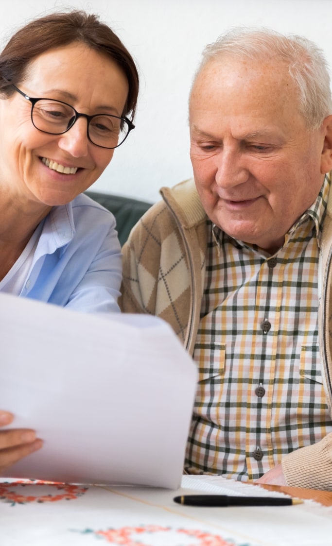 old veteran and wife reading letter